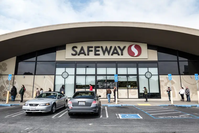 Customers wait in a line outside a a Safeway Inc. store, operated by Albertsons Cos. Inc., in San Francisco in 2020.