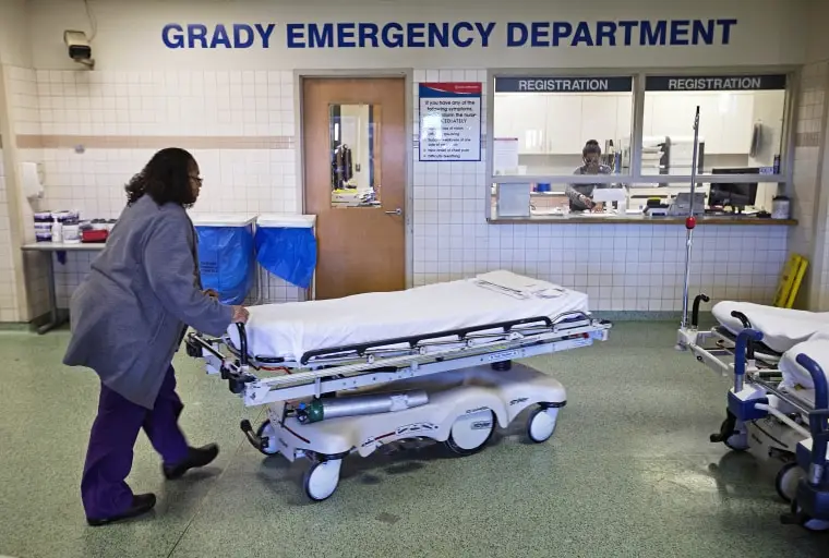 A worker wheels beds through the emergency department at Grady Memorial Hospital, in Atlanta on  Jan. 24, 2014.