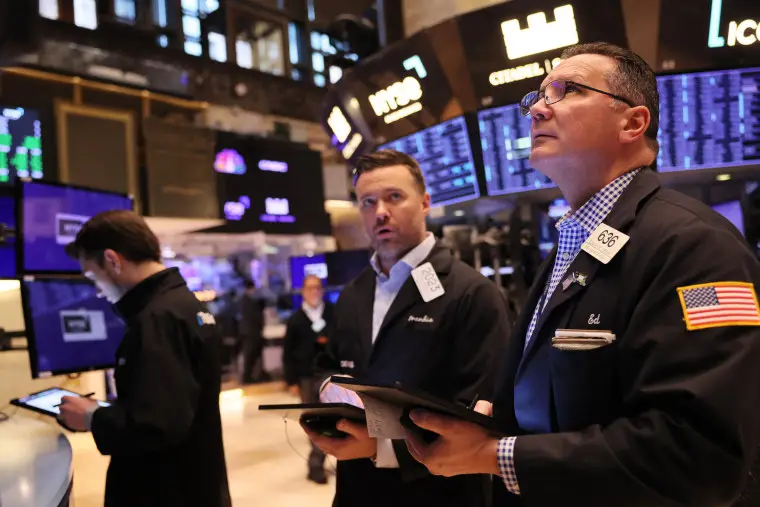 Traders work on the floor of the New York Stock Exchange