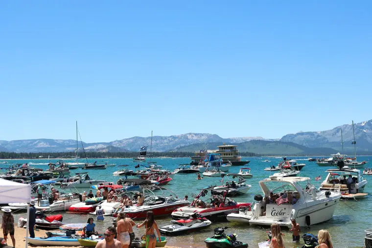 Boats sit in Lake Tahoe near hole 17 during a golf tournament on July 9, 2022. 