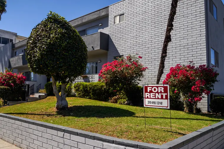 A 'for rent' sign is displayed outside an apartment building on Sept. 22, 2022 in Los Angeles.