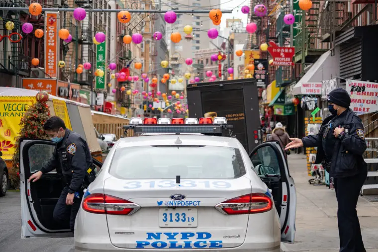 NYPD officers hand out information about hate crimes occurring in Asian communities on March 17, 2021 in New York.