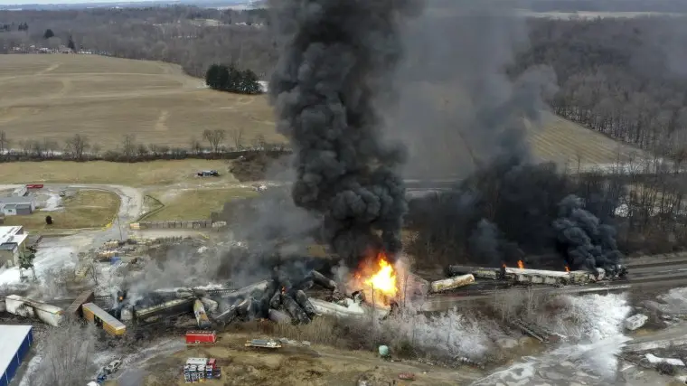 Portions of a Norfolk Southern freight train burns after a derailment in East Palestine, Ohio