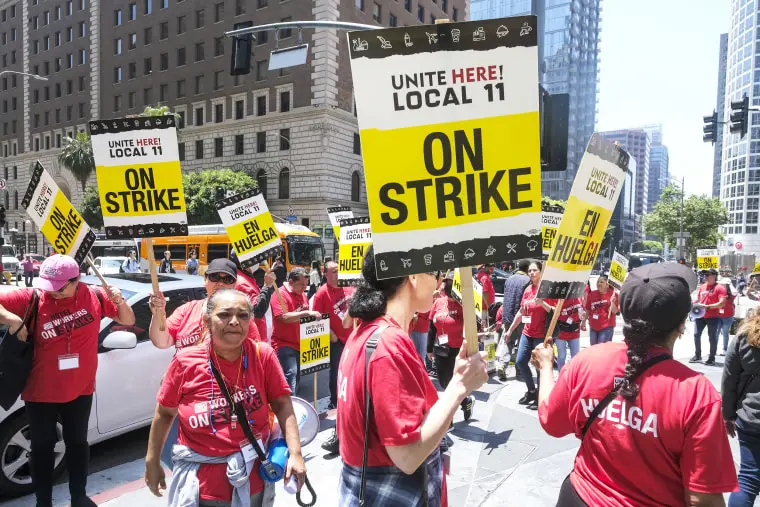 Striking hotel workers holding placards rally outside the Intercontinental Los Angeles Downtown. Southern California hotel workers are ON STRIKE! Thousands walked off the job at properties across Downtown Los Angeles and Santa Monica, in an effort to secure higher pay and improvements in health care and retirement benefits. (Photo by Ringo Chiu / SOPA Images/Sipa USA)(Sipa via AP Images)