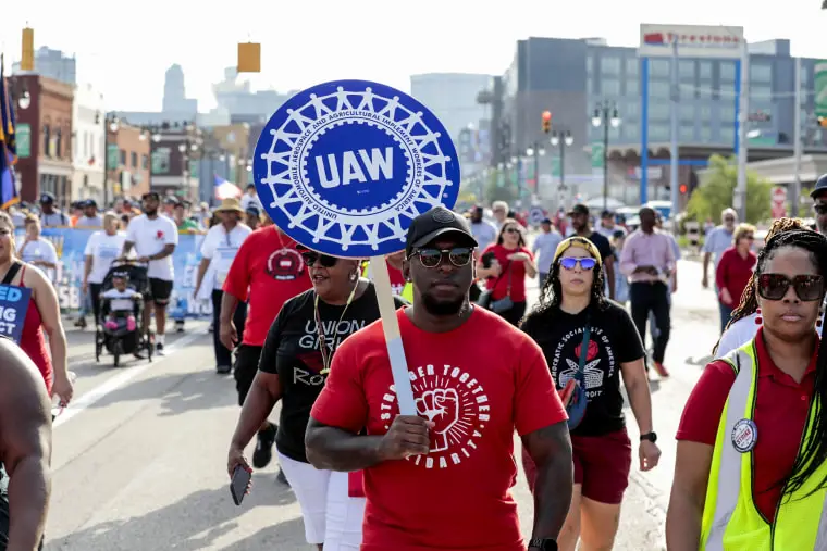 United Auto Workers members and supporters march during a Labor Day parade in Detroit on Sept. 4, 2023.