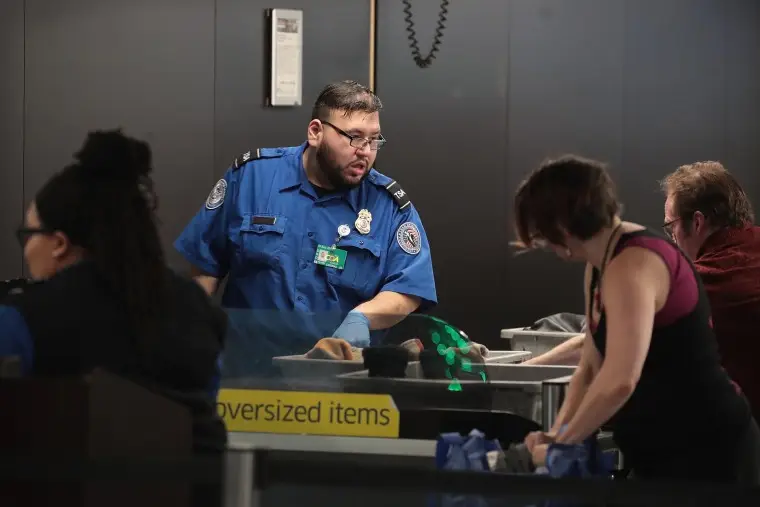 TSA Agents Work At Airport Security As Government Shutdown Continues